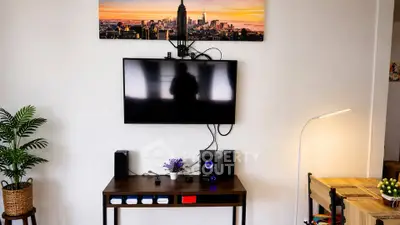 Modern living room with wall-mounted TV and stylish decor