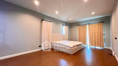 Spacious bedroom with modern design and elegant lighting