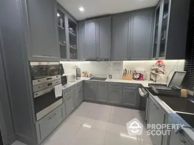 Modern kitchen with sleek cabinetry and built-in appliances in a stylish home.