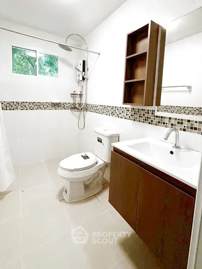 Modern bathroom with sleek fixtures and stylish tile accents