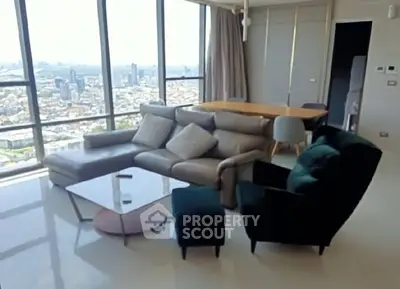 Luxurious living room with panoramic city view and modern furniture