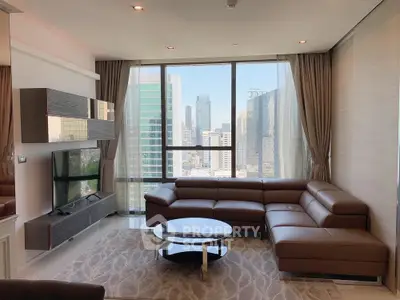 Luxurious modern living room with stunning city view and elegant furnishings.