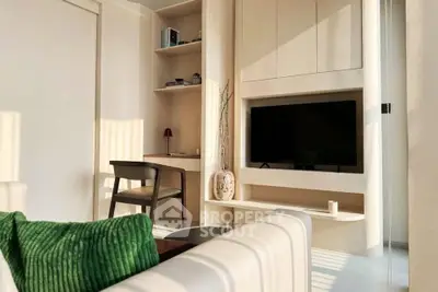 Modern living room with built-in TV unit and cozy workspace
