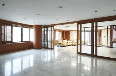 Spacious living room with elegant sliding glass doors and abundant natural light.