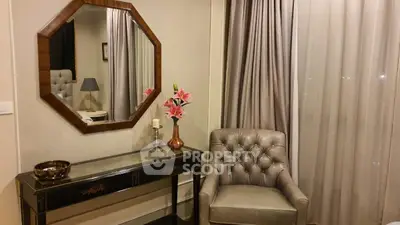 Elegant living room corner with plush armchair and decorative mirror