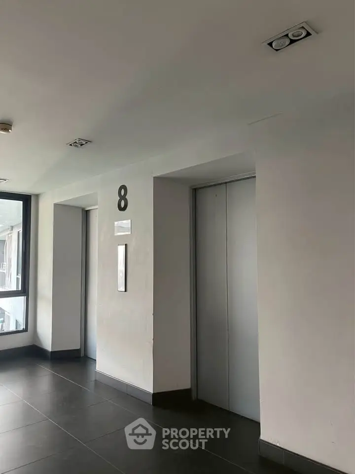 Modern building elevator lobby with sleek design and natural light