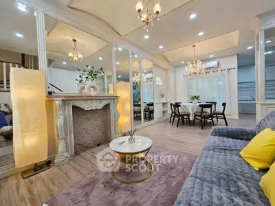 Elegant living room with mirrored walls and chandelier lighting