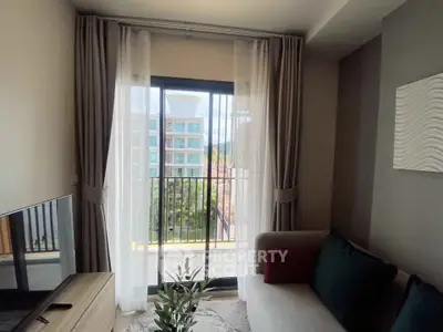 Cozy living room with balcony view in modern apartment
