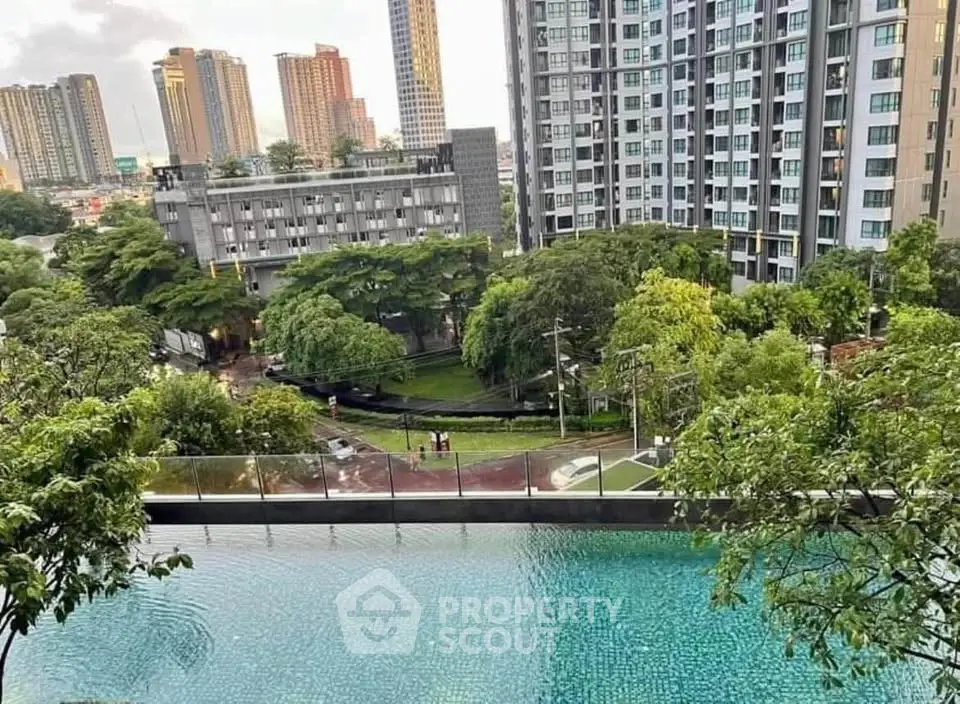 Luxurious high-rise apartment with stunning city view and infinity pool, surrounded by lush greenery.