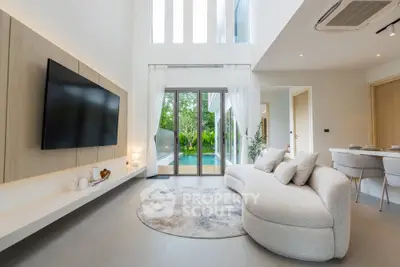 Luxurious modern living room with pool view and elegant decor
