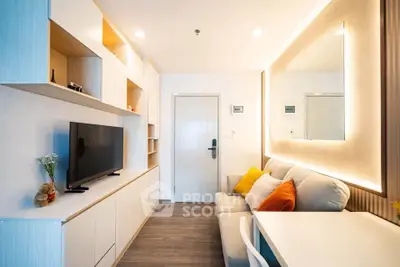 Modern living room with sleek furniture and ambient lighting, perfect for cozy relaxation.