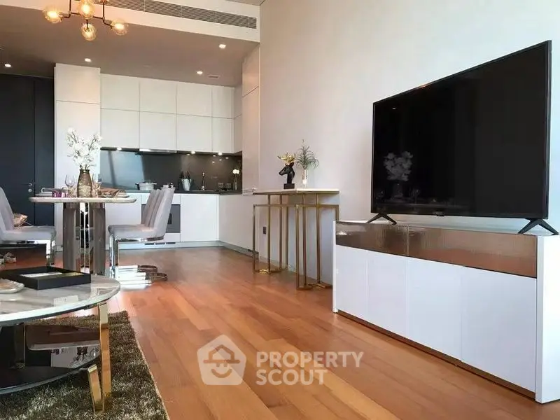 Modern open-plan living room with sleek kitchen and stylish decor