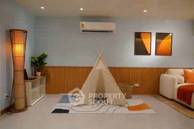 Charming living room with modern decor and cozy teepee tent, perfect for family relaxation.