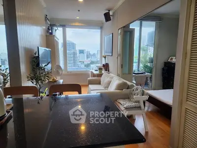Modern living room with city view, open layout, and stylish decor