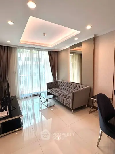 Modern living room with elegant sofa and floor-to-ceiling windows