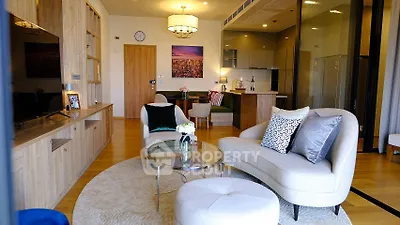 Modern living room with stylish furniture and open kitchen layout