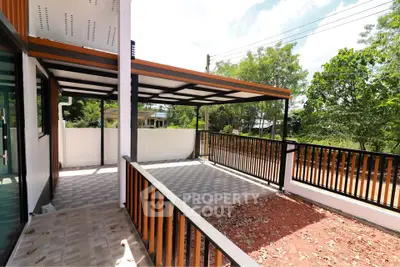 Modern outdoor patio with tiled flooring and garden view