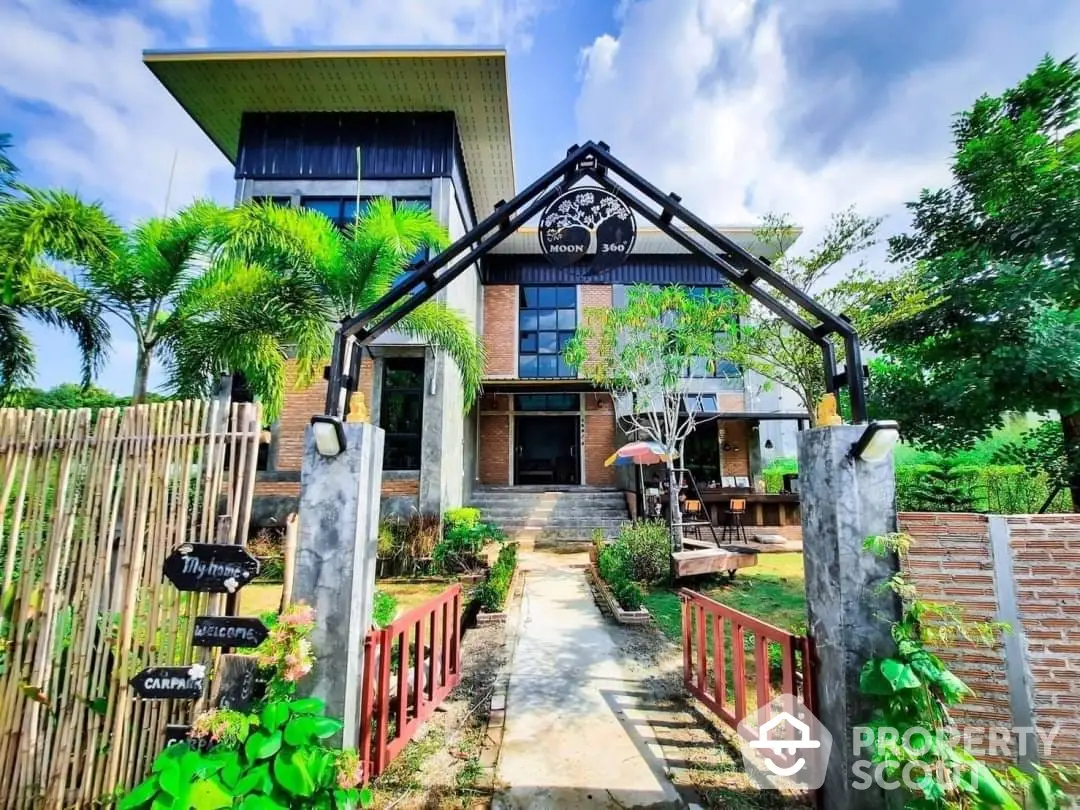 Charming modern home with lush landscaping and a welcoming entrance, featuring a unique blend of traditional and contemporary architecture.