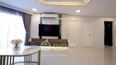Modern living room with sleek design and large TV setup
