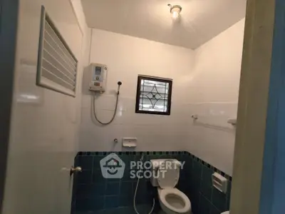 Cozy bathroom with modern shower and classic tile design, perfect for a comfortable living experience.