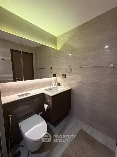 Modern bathroom with sleek fixtures and ambient lighting