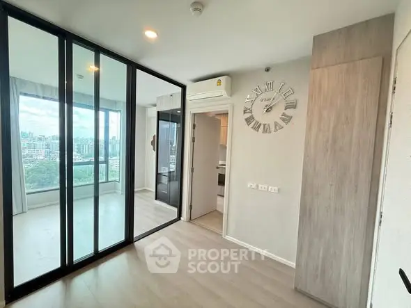 Modern apartment interior with mirrored wardrobe and city view