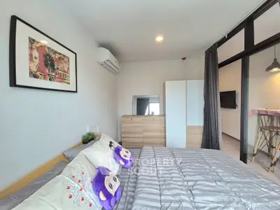 Modern bedroom with stylish decor and ample natural light