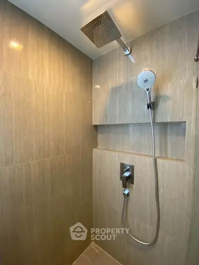 Modern bathroom with sleek shower fixtures and elegant tile design