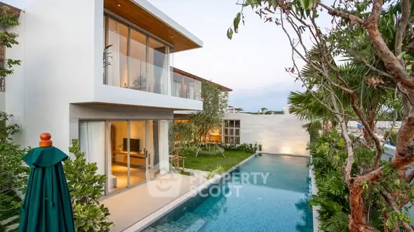 Luxurious modern villa with private pool and lush garden, perfect for serene living.