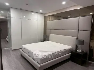Luxurious modern bedroom with sleek design and elegant lighting