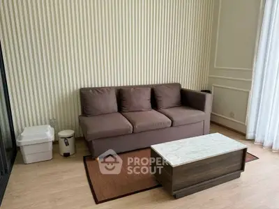 Cozy living room with brown sofa and modern coffee table