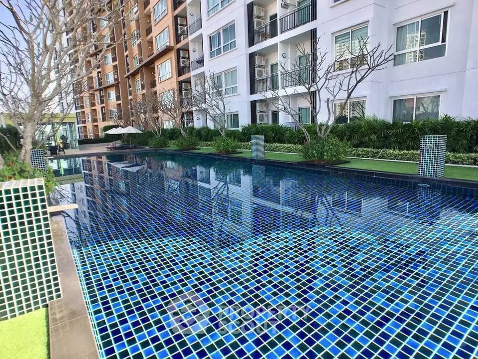 Luxurious condominium with stunning outdoor pool and modern architecture.