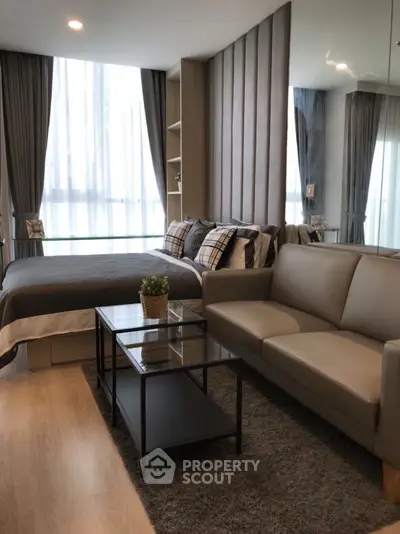 Modern studio apartment with stylish decor and cozy living area