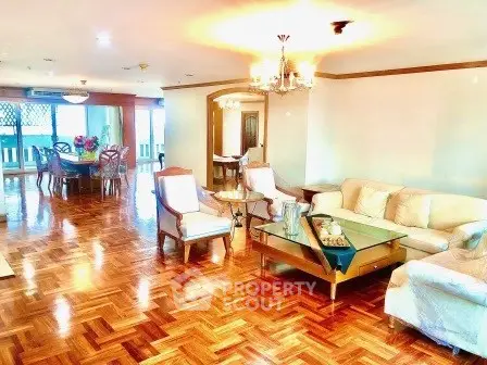 Spacious and elegant living room with parquet flooring and stylish furniture