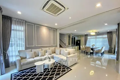 Spacious modern living room with elegant decor and dining area