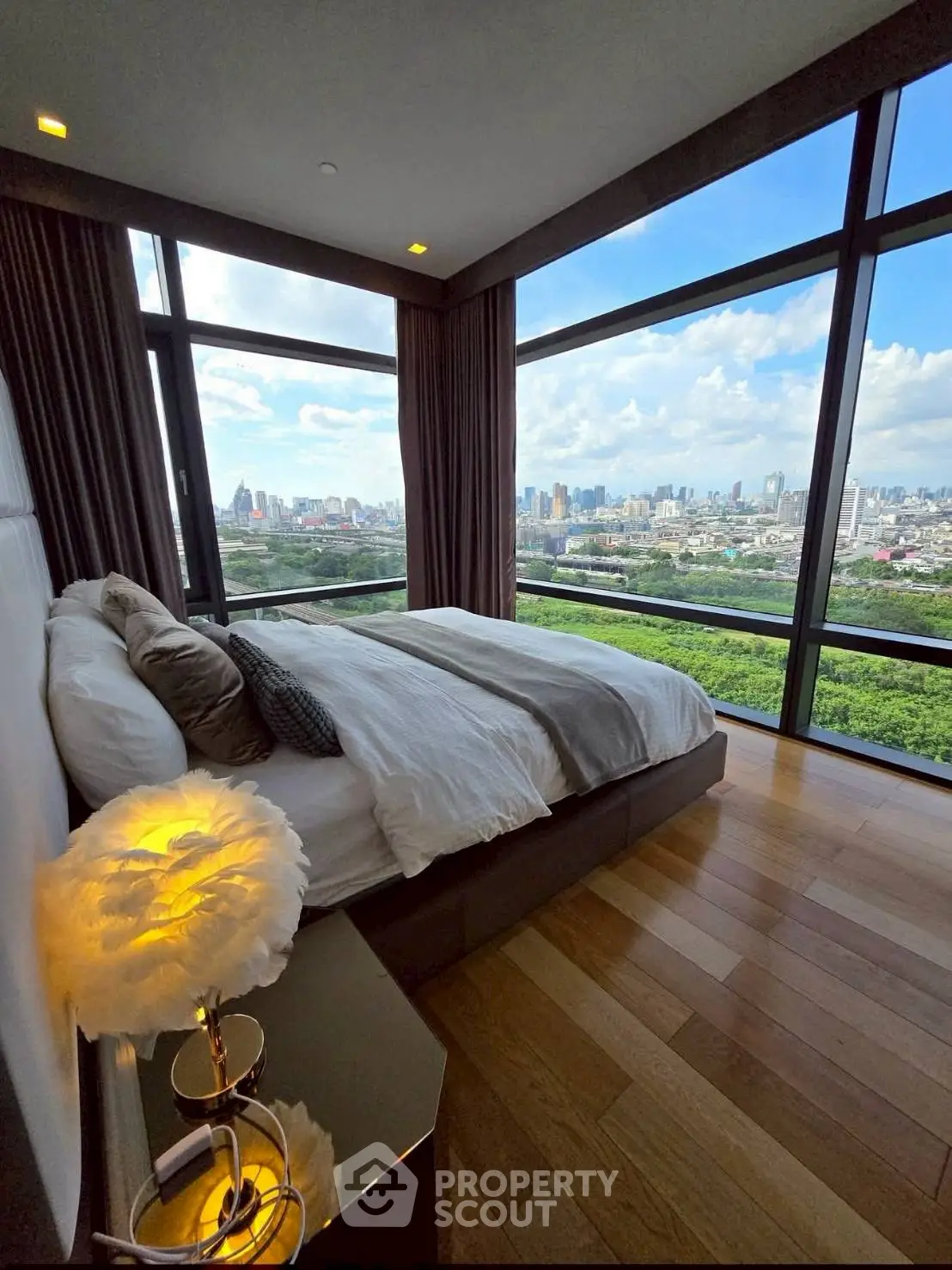 Luxurious bedroom with panoramic city view and elegant decor