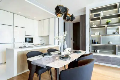 Modern dining area with elegant decor and open kitchen layout