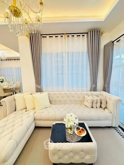 Luxurious living room with elegant tufted sofa and chic decor