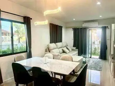 Modern living room with elegant dining area and stylish lighting