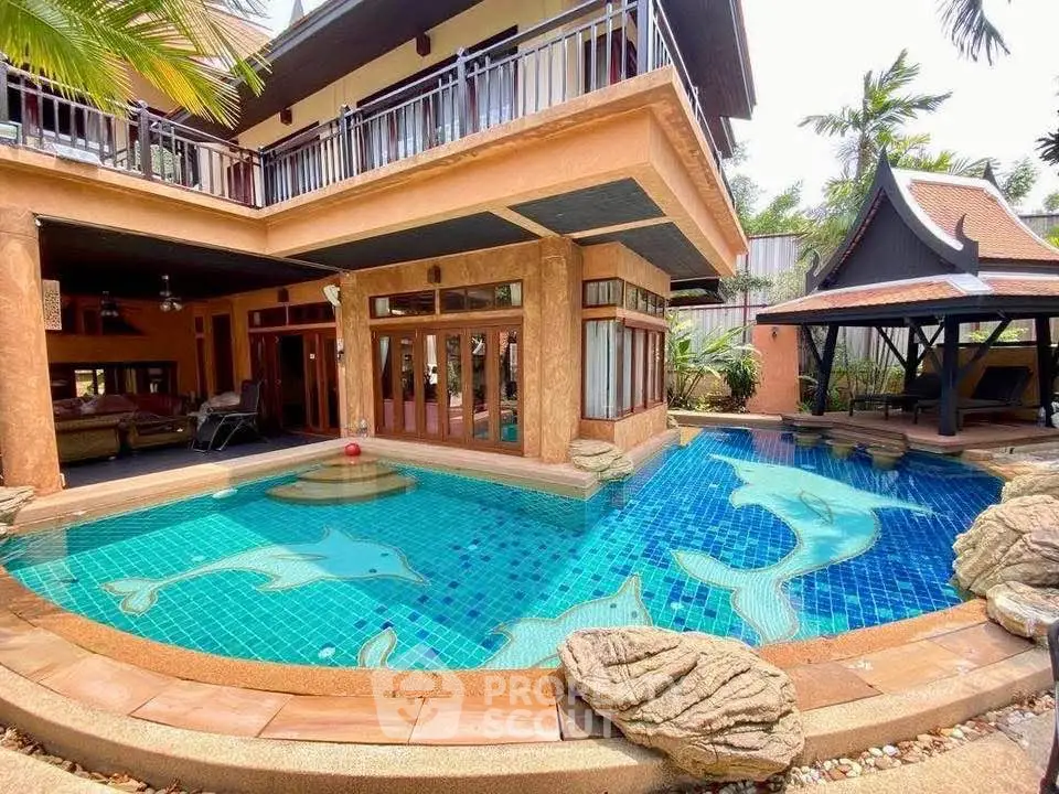 Stunning tropical villa with unique dolphin-themed pool and lush garden.