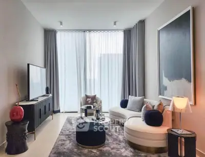 Elegant modern living room with stylish furniture and large window view
