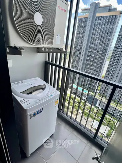 High-rise apartment balcony with washing machine and city view