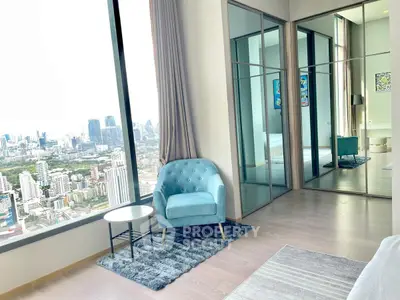 Luxurious high-rise apartment with stunning city view and elegant interior design.