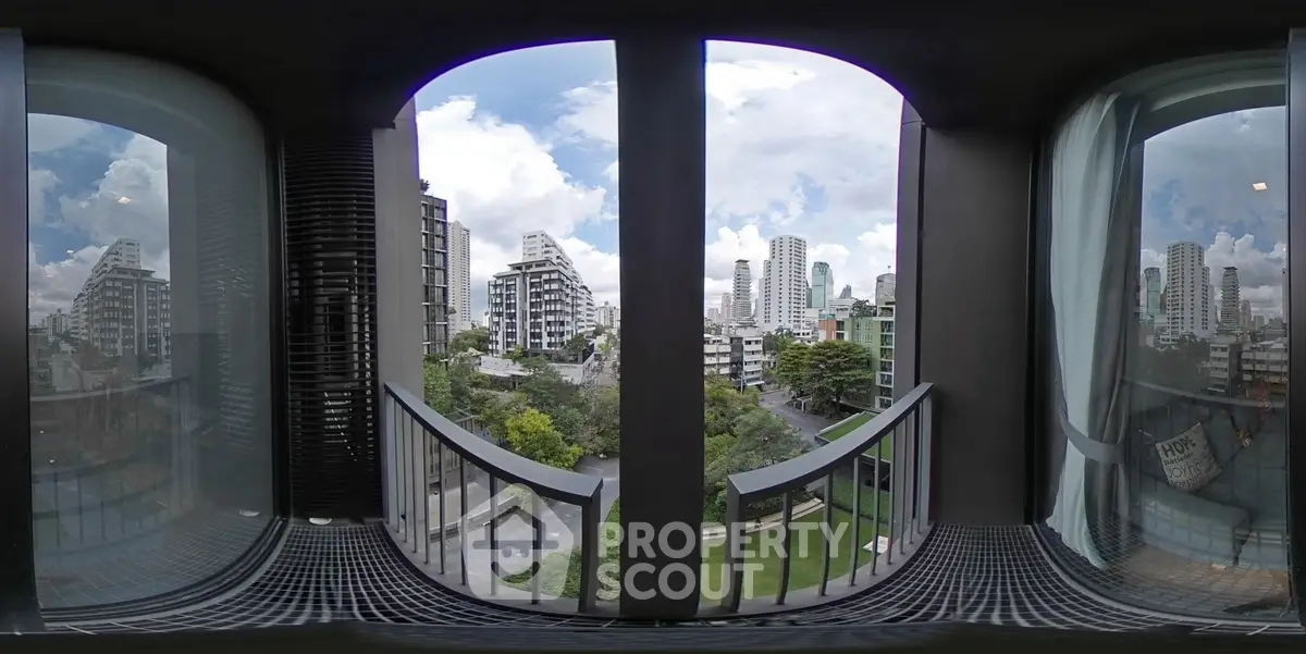 Stunning cityscape view from a modern balcony with sleek railing design.