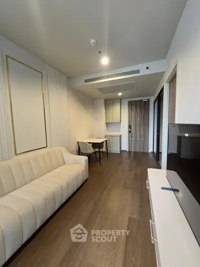 Modern living room with elegant sofa and dining area in stylish apartment