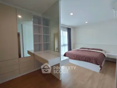 Modern bedroom with built-in storage and stylish decor