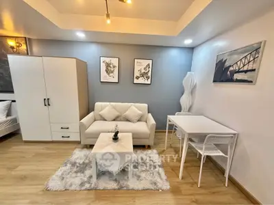 Modern living room with cozy white sofa and stylish decor