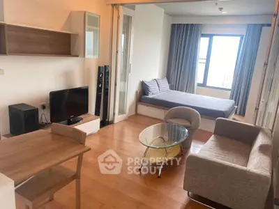 Modern studio apartment with open layout, featuring cozy living area and stylish furnishings.