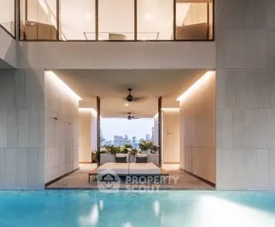 Luxurious modern home with stunning poolside view and elegant architecture