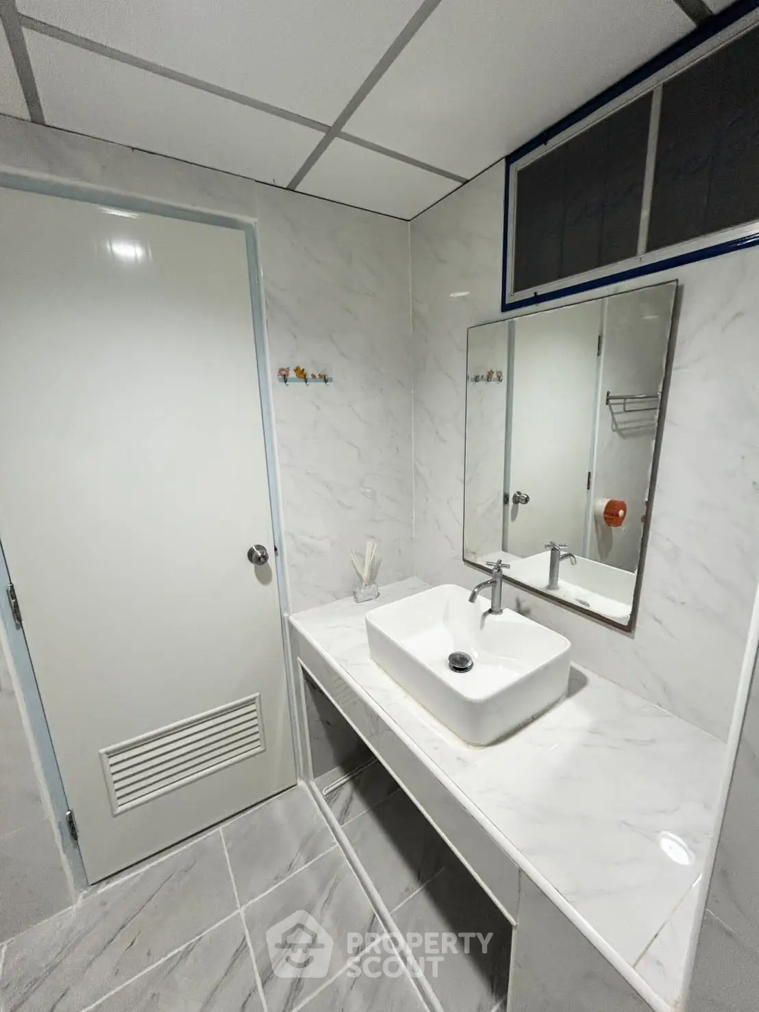 Modern bathroom with sleek marble finishes and stylish sink design